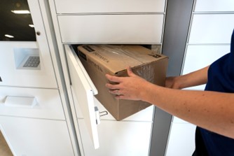 Photo of a parcel being retrieved from a ParcelPort smart locker